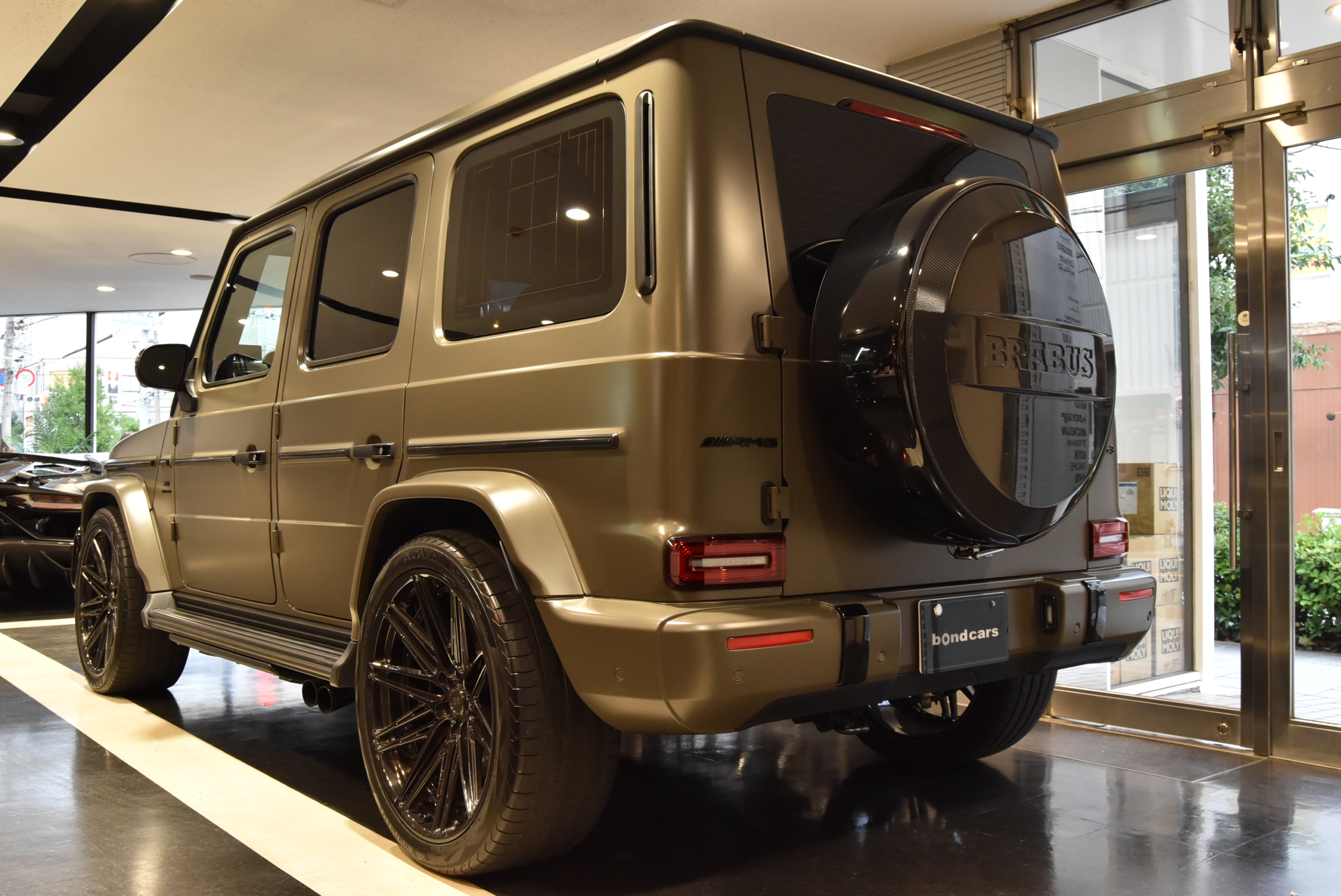 限定車MANUFAKTURエディション 左ハンドル BRABUSマフラー 1221ホイール BRABUSフロントリップ BRABUSカーボンボンネットパネル BRABUS背面タイヤカバー 本国純正OPバンパーガード BRABUSグリルエンブレム